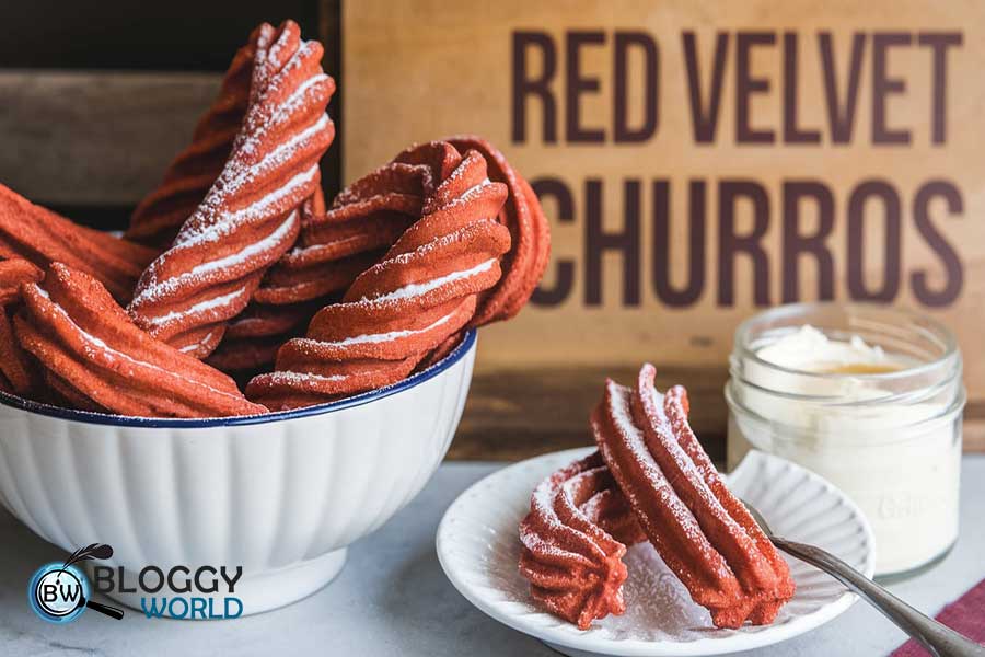 Red churros with cream cheese dipping sauce showcasing unique churro flavours