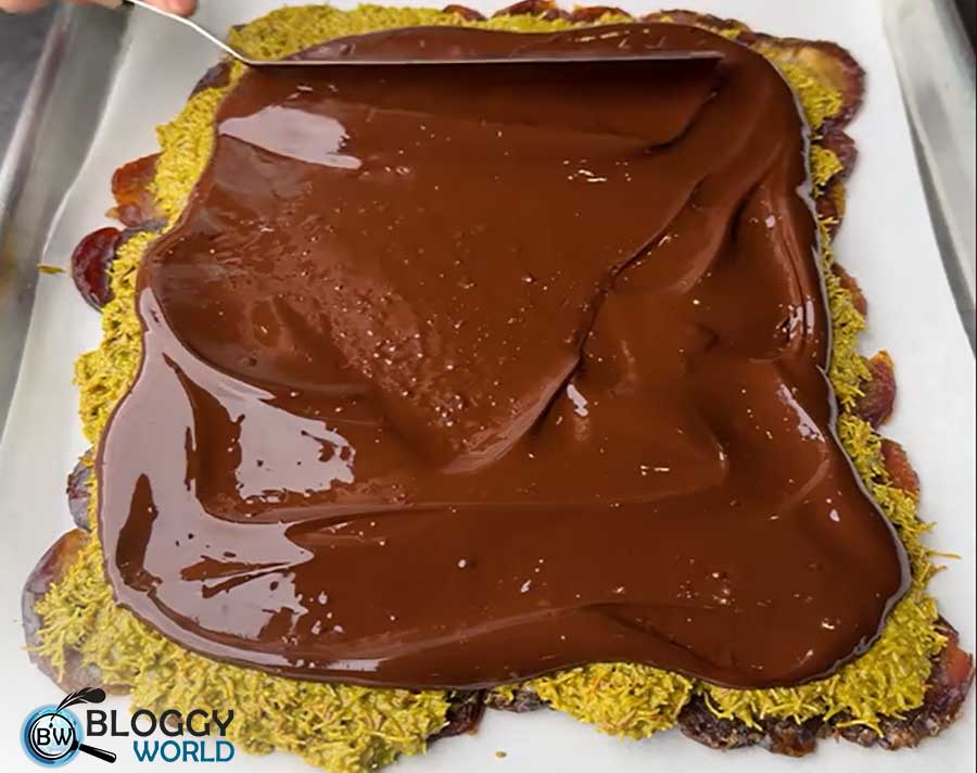 three layered kunafa chocolate with date layer kunafa layer and chocolate layer is ready to serve