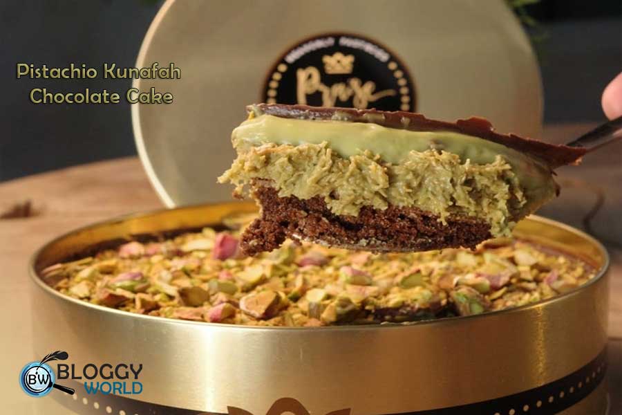 a slice of dubai viral chunk bake house pistachio kunafah chocolate dream cake is taken off from a tin