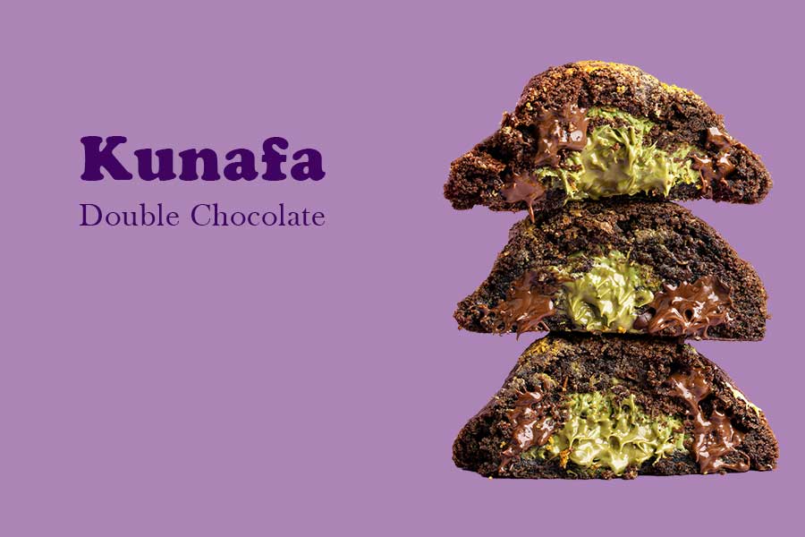 A stack of three limited addition crumble kunafa double chocolate cookies with creamy filling, set against a purple background.